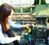 Vicki placing offering at Hachi's memorial in Aoyama Memorial Park