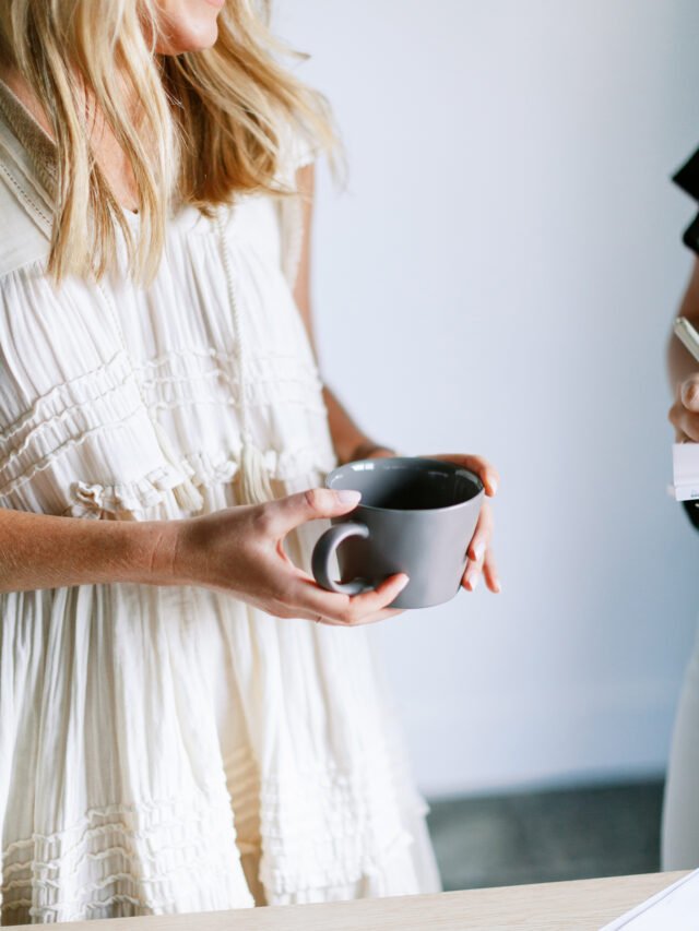 Woman holding coffee cup